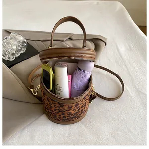 Top view of leopard print bucket bag showing interior space for phone and cosmetics