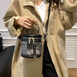 Fashionable patchwork bucket bag with black leather and geometric patterns for women