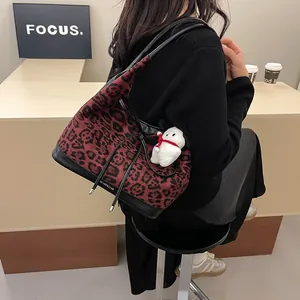Contrast leopard print tote bag for women with red and black plush fabric and charms