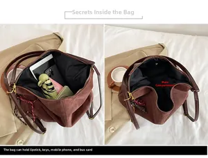 Detail of spacious main compartment in brown suede tote bag holding daily essentials