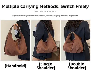 Close-up of brown suede bag showing multiple carrying styles and woven pendant