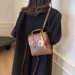 Brown retro small backpack with dachshund embroidery and white plush bear charm charm