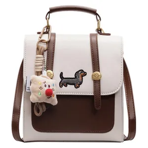 Mini contrast backpack with dachshund embroidery and beige plush doll charm