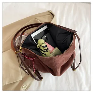 Top view of spacious brown suede tote bag showing large capacity for daily essentials