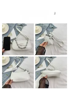 Detailed views of a white faux leather shoulder bag with silver hardware and heart charm