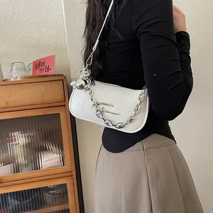 Chic white ruched shoulder bag with chunky silver chain and decorative metal orb charm
