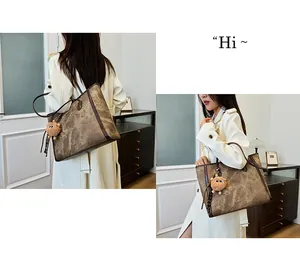 Detail of vintage brown textured tote bag with high-capacity design and plush monster charm