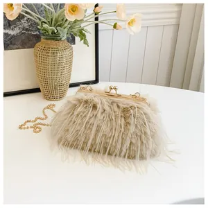 Close-up of beige fluffy faux fur clutch bag with elegant golden clasp and chain strap