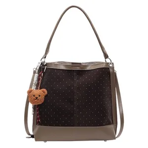 Retro suede women's shoulder bag with polka dot pattern and plush bear charm