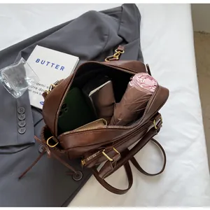 Retro brown Boston bag interior view showing large capacity for daily essentials