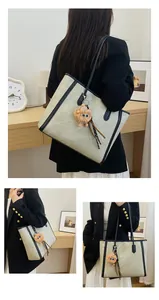 Three views showing a large green tote bag with black trim and a plush monster charm