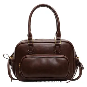 Classic vintage dark brown boston handbag with gold metal hardware and front zip pocket