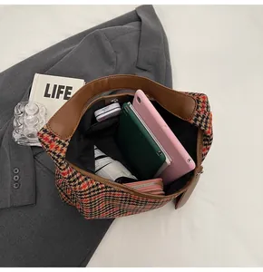 Top view of houndstooth tote bag interior showing large capacity for tablet and daily items