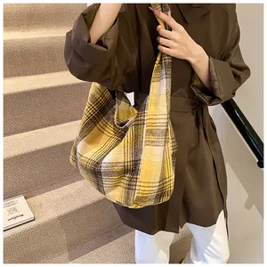 Detail of yellow plaid woolen tote bag showing spacious capacity and soft fabric texture