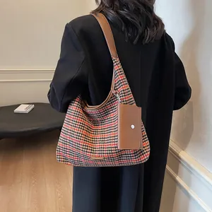 Classic houndstooth hobo shoulder bag with leather trim and small side pouch
