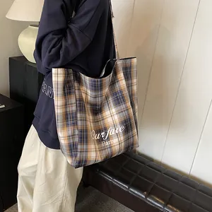 Yellow and blue plaid oversized tote bag with Our Fave Party text for autumn winter