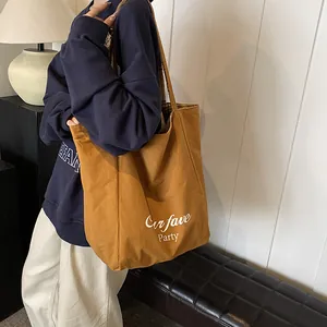 Caramel canvas tote bag with Our fave Party print and plaid lining for women