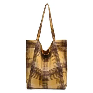 Large yellow plaid wool tote bag with long shoulder straps and handmade label for winter