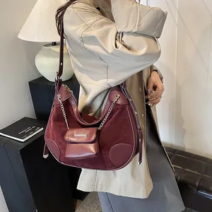 Retro burgundy crescent shoulder bag in leather with silver chain strap and small pouch