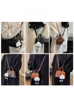 Mini vintage crossbody bags in four colors shown on model with cute cloud charms