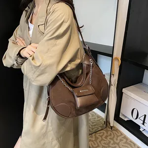 French retro dark brown half-moon shoulder bag with suede拼接 and mini coin purse charm
