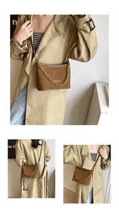 Close-up of brown frosted leather bucket bag featuring gold chain and fashion logo print