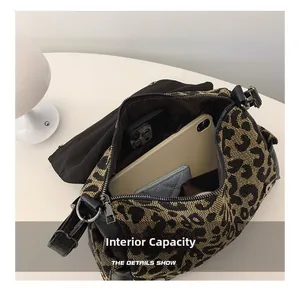 Detailed internal capacity of leopard print canvas tote bag showing storage space