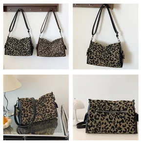 Detail of leopard print tote bag showing canvas texture, leather strap, and side pocket