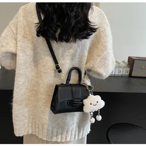 Classic black leather square bag with cute white cloud plush pendant and shoulder strap