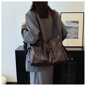 Detail view of large dark brown retro PU leather tote bag with functional side pocket