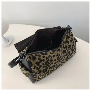 Interior view of leopard jacquard tote showing spacious main compartment and zipper detail