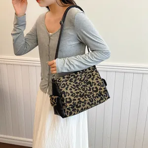Large leopard print crossbody bag in jacquard fabric with black leather shoulder strap