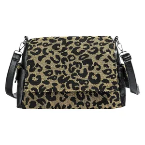 Retro leopard print tote bag with black PU leather trim and adjustable crossbody strap