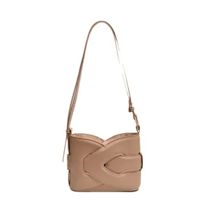Minimalist beige crescent shoulder bag with structured layered leather design for women