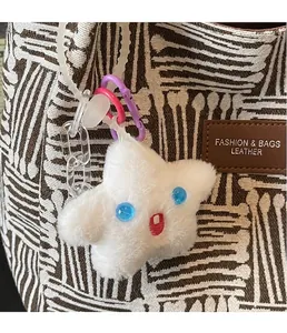 Detail of white plush star keychain with colorful carabiner clips and plastic chain