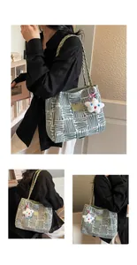 Detail view of woven tote bag with green abstract pattern and star plush charm