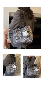 Macro shot of retro woven tote bag featuring geometric patterns and black leather handles