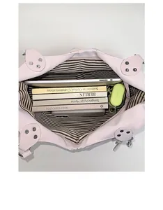 Detailed interior of large tote bag showing stripe lining and ample storage space