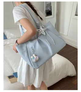 Stylish blue polka dot tote bag for women, large capacity shoulder bag for daily commuting.