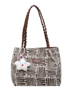 Large canvas tote bag with abstract jacquard pattern and star plush pendant