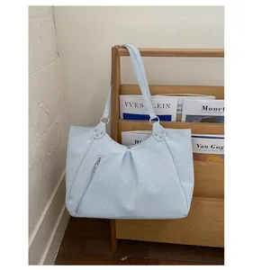 Light blue polka dot canvas tote shoulder bag with large capacity and casual style.