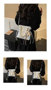 Quilted bucket bag with chain strap and horse charm shown on model in various angles