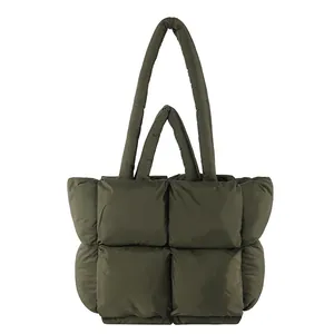 Deep olive green quilted puffer tote bag with large square padding and soft shoulder straps