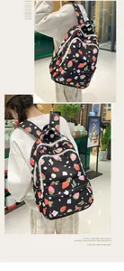 Close-up of strawberry print backpack showing durable nylon fabric and zipper details
