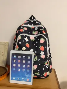 Large capacity school backpack with strawberry and floral prints in a black finish