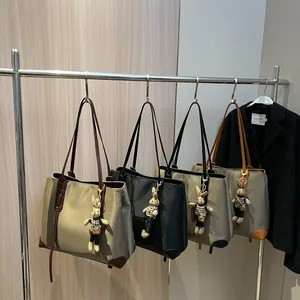 Large capacity nylon tote bags in four colors with leather trim and rabbit pendants