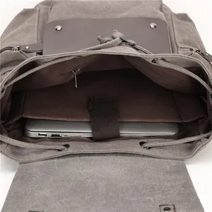 Interior de mochila de lona vintage con compartimento para portátil y cordón de cierre