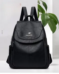 Close-up of black lychee grain leather backpack with silver kangaroo logo and side pocket