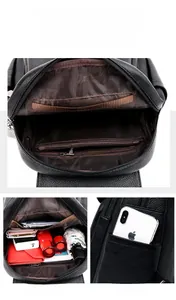 Detail view of large capacity leather backpack with multi-pocket internal storage compartments