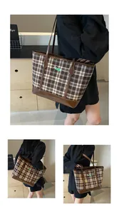 Detailed close-up of brown checkered tote bag with dachshund embroidery and faux leather trim